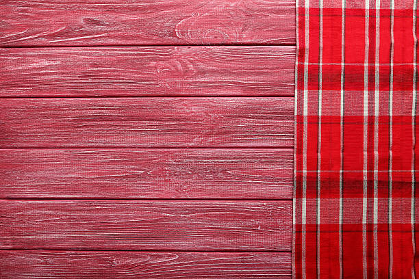 istock Napkin on red wooden table, close up 524551298
