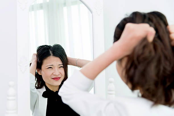 istock Tired businesswoman looking at herself 524552836