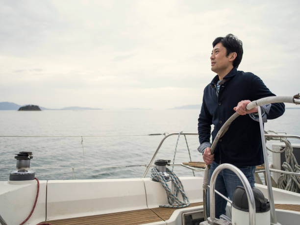istock Man sailing on yacht in the ocean. 524554486