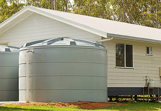istock Rainwater conservation tanks on new house 524556198