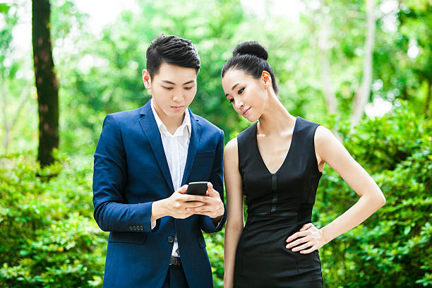 istock Young Asian Couple Posting Selfies on Social Media 524556616