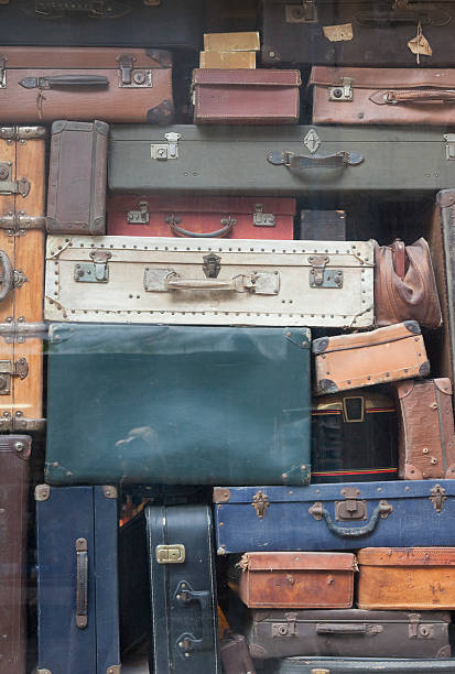 Old Suitcases Old Suitcases - Saint Malo, Brittany, France old luggage tag stock pictures, royalty-free photos & images