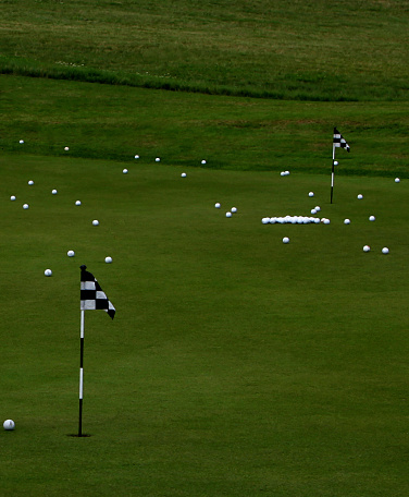 Golf flags and golf balls