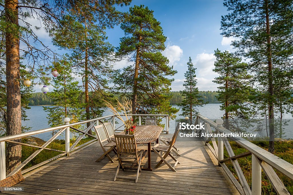 Veranda with wooden furniture Wooden furniture table and chairs in the nature environment Lake Stock Photo