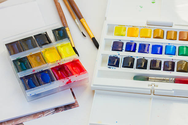 istock set of watercolor paints with brushes 524579775