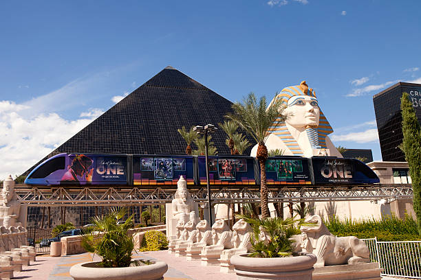 Luxor Casino and Hotel in Las Vegas , Nevada Las Vegas, Nevada, USA - September 20, 2014: Luxor Hotel and Casino located on the southern end of  Las Vegas Blvd has the form of an Egyptian pyramid at the entrance stands a large statue of the Sphinx The picture also shows the monorail that runs between Excalibu - Luxor - Mandalay Bay Casinos las vegas metropolitan area luxor luxor hotel pyramid stock pictures, royalty-free photos & images