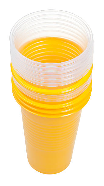 istock stack of yellow and transparent plastic glasses 524580653