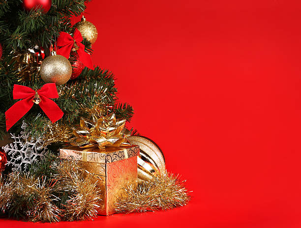 istock Christmas. Gift Box under Christmas Tree over Red Background 524580665