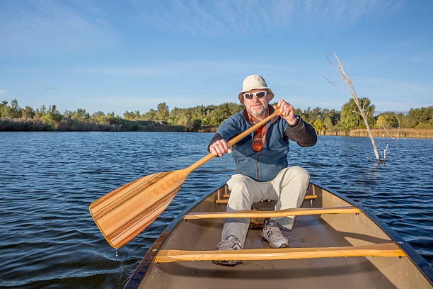 istock enjoying canoe paddling on lake 524581953