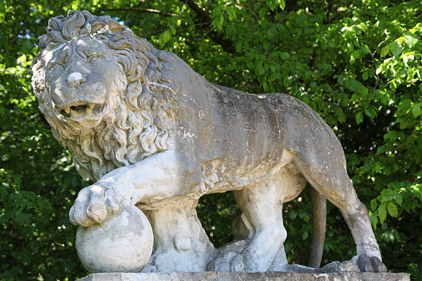 Lublin, Lubelskie / Poland - 2019/08/18: Monumental statue of a lion, symbol of Lviv city in front of medieval Lublin Castle royal fortress in historic old town quarter
