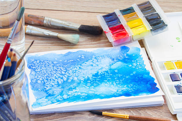 istock canva with frame of paints and brushes 524582861