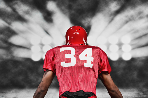 Rear view of American football playerhttp://www.twodozendesign.info/i/1.png
