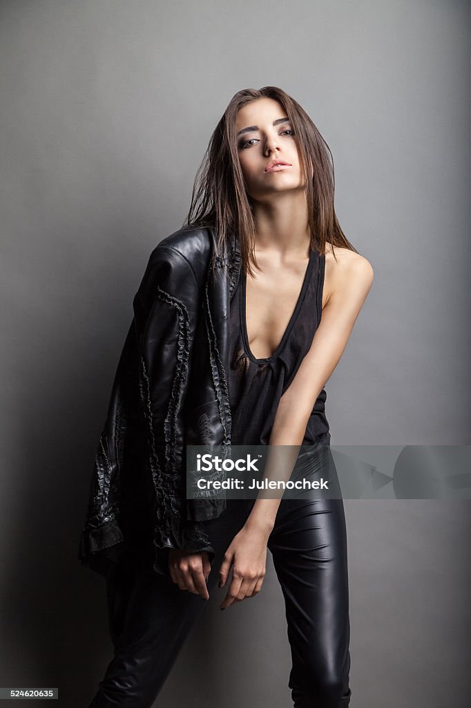 Fashion Model Wearing Leather Pants And Jacket Stock Photo - Download Image  Now - Adult, Arts Culture and Entertainment, Backgrounds - iStock