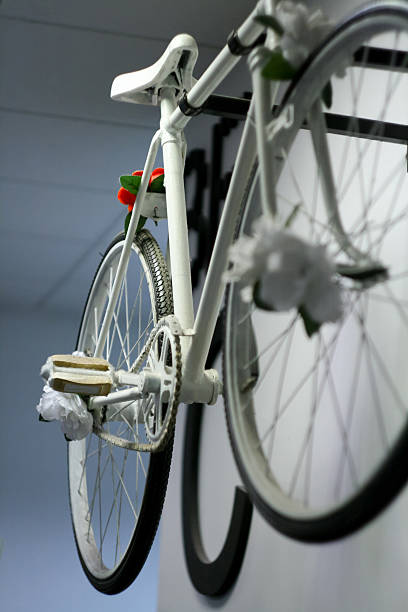 istock White retro vintage old style bicycle hanging on the wall 524620661