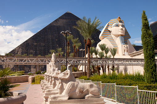 Las Vegas, Nevada, USA - September 20, 2014: Luxor Hotel and Casino located on the southern end of  Las Vegas Blvd has the form of an Egyptian pyramid at the entrance stands a large statue of the Sphinx 