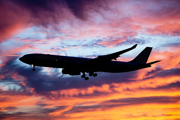 istock Aircraft landing at dusk 524621833