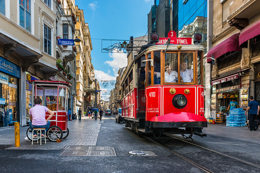 Istanbul, Turkey - July 31, 2014: The Taksim-Tunel Nostalgia Tram trundles along the streets of Taksim on July 31, 2014 in Istanbul, Turkey.