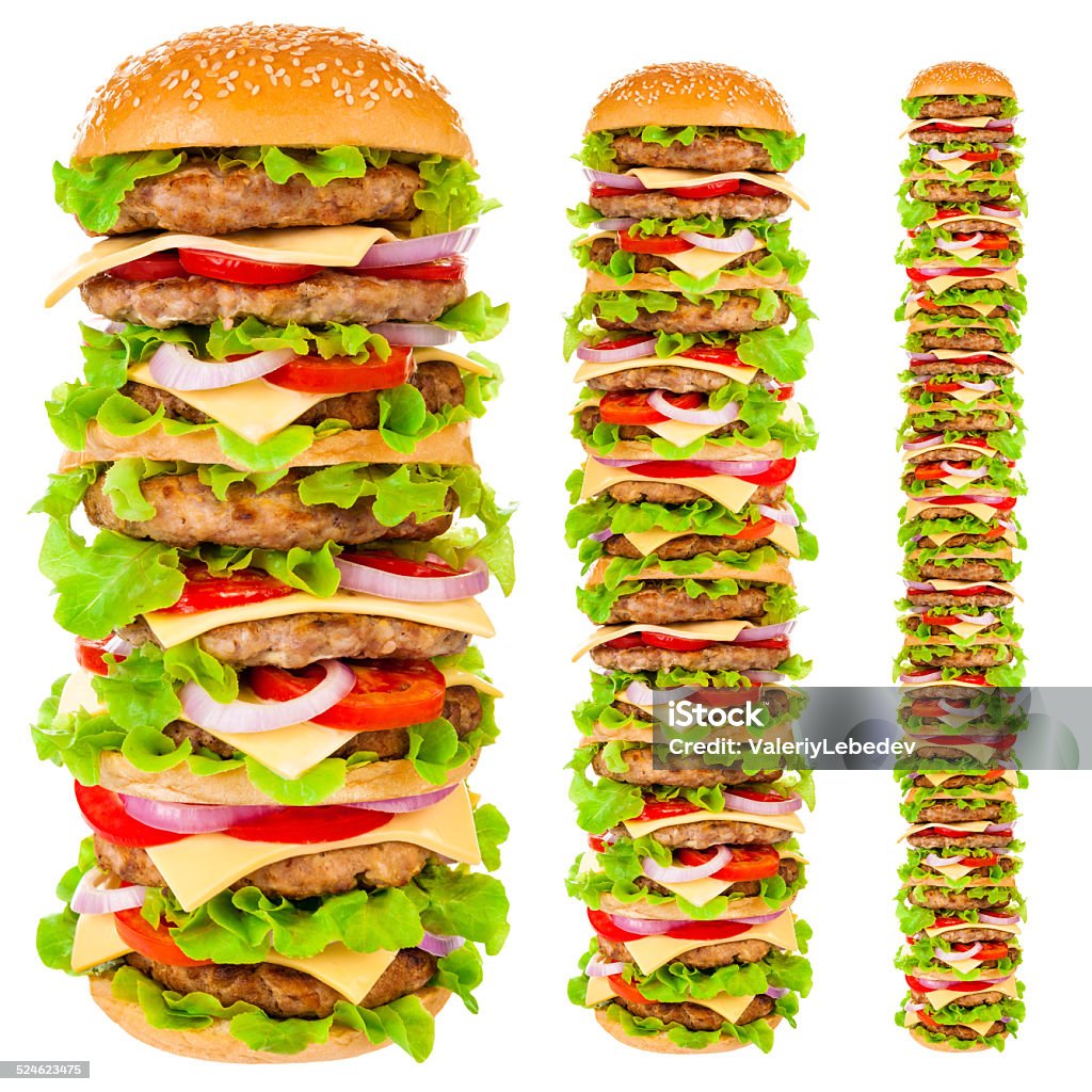 Big hamburger on white background Big beautiful juicy burger with meat and vegetables. Isolated on white background American Culture Stock Photo