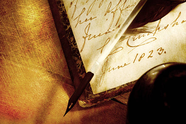istock Old book with feather and inkpot 524624075