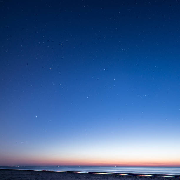 istock night sky with stars on the beach. space view. 524625715