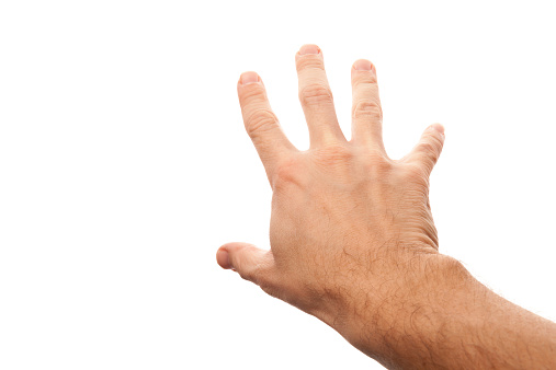 Right male hand trying to grab something, first-person view photo with selective focus isolated on white background