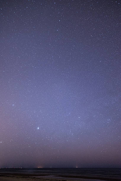 istock night sky with stars on the beach. space view. 524651649