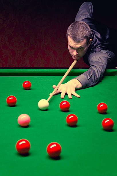 snooker pro - pool game pool table aiming men foto e immagini stock