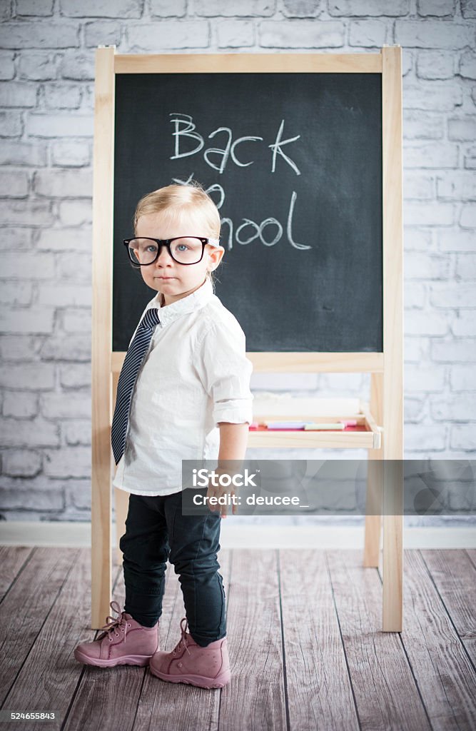 Little baby girl with blackboard 12-17 Months Stock Photo