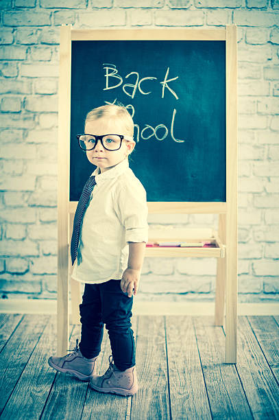 istock Little baby girl with blackboard 524655853