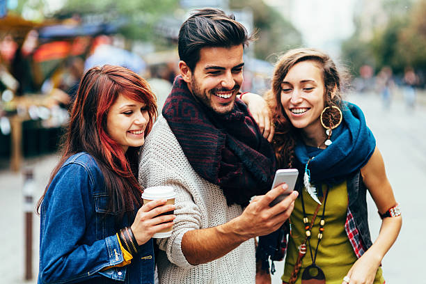istock Happy friends surfing the net 524656009