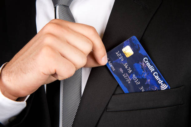 istock Business man holding a contactless credit card 524656305