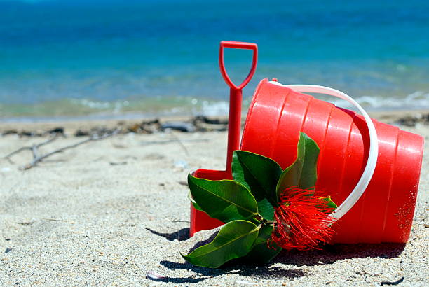 Two spades and a bucket on a sandy beach in Cornwall