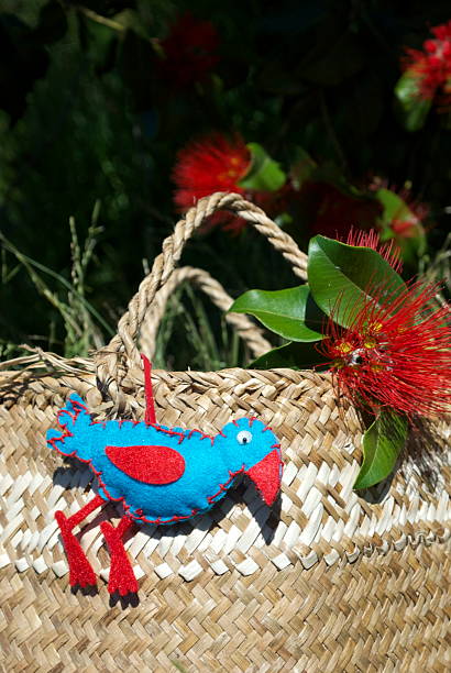 istock New Zealand Christmas, a Kete with Decorations & a Pohutakawa Tree 524656551