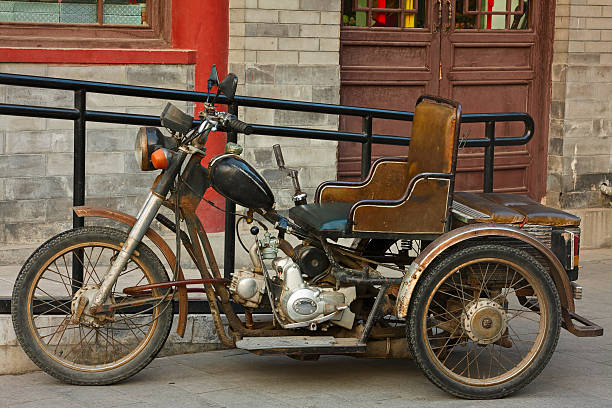 istock Old three wheel motorcycle in Beijing hutong 524686927