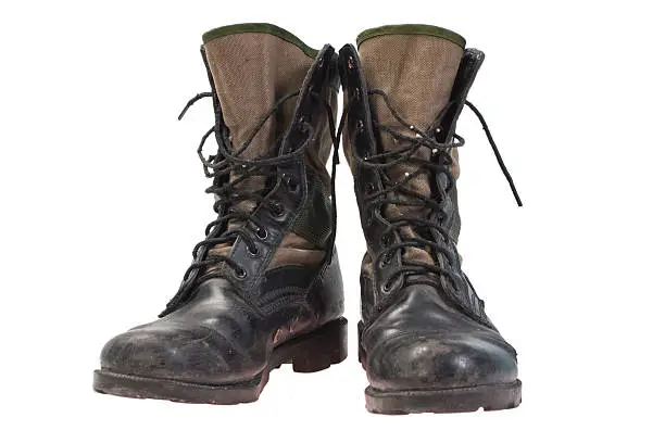 old used jungle boots isolated