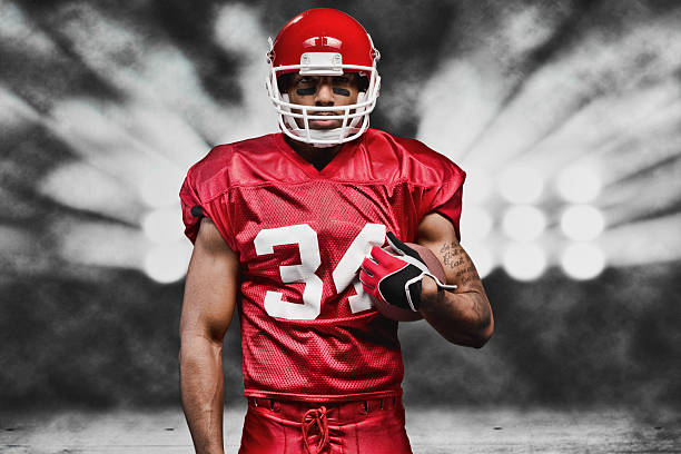 istock American football player in front of floodlight 524690767