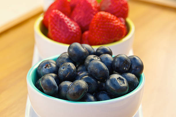 istock Blueberry and strawberry in white cans 524692531