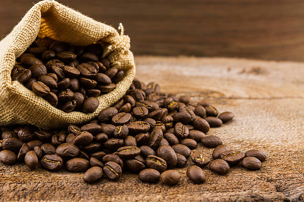 istock Brown roasted coffee beans in canvas sack. 524694653