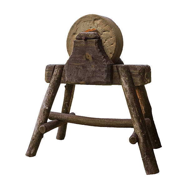 istock Circular grindstone on  serious wooden stand 524696728