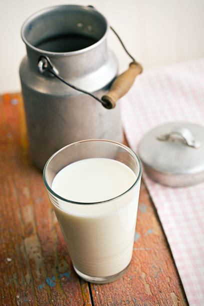 istock milk in glass on old wooden table 524696916