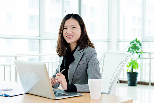 Businesswoman Working In Office Stock Photo - Download Image Now