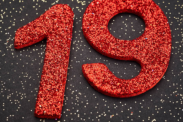 istock Number nineteen red color over a black background. Anniversary 524698524