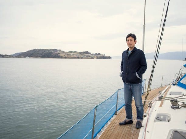 istock Man sailing on yacht in the ocean. 524702566