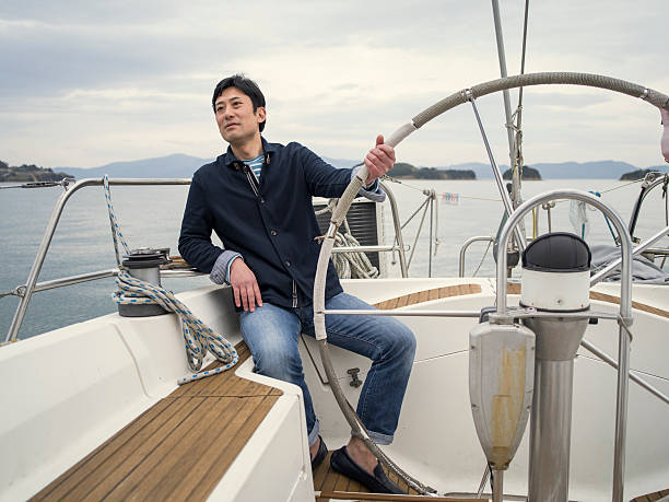 istock Man sailing on yacht in the ocean. 524702668
