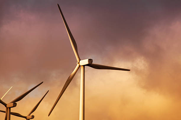 istock Wind turbines with sunset background, sustainable energy, environmental conservation. 524703416