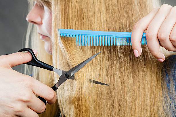istock Girl is cutting her hair down. 524707704