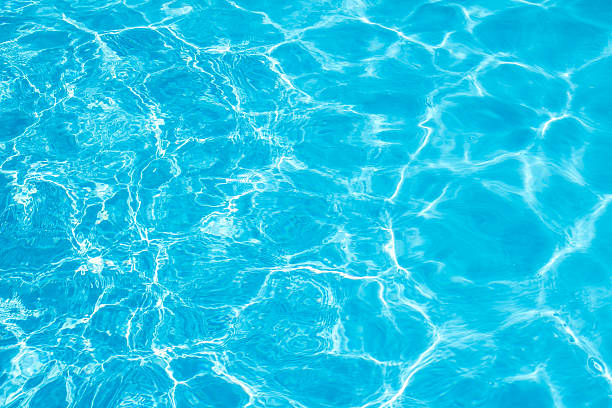 istock Background of rippled pattern of clean water in a blue. 524708388