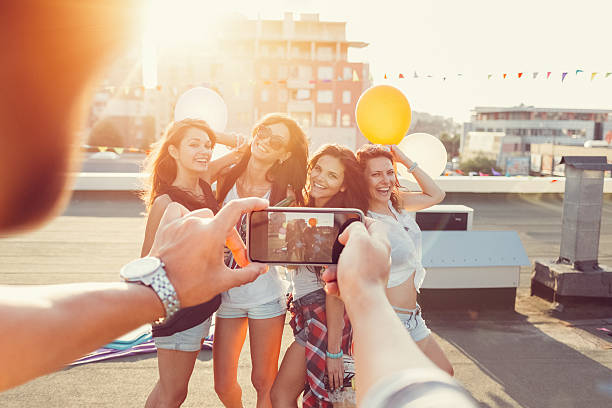 istock Friends partying on a rooftop terrace 524708730