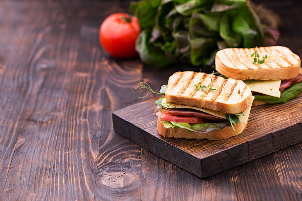 istock Sandwiches with bacon, cheese, greens and pea sprouts 524709530
