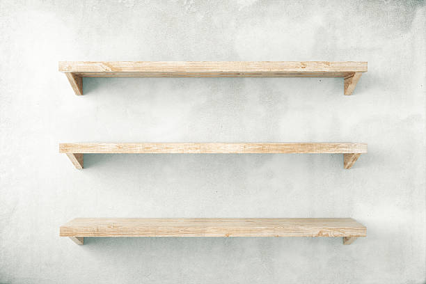 Shelves on concrete Empty shelves on concrete wall background. Mock up, 3D Render shelf stock pictures, royalty-free photos & images